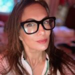 Head shot of author with a blurred background.